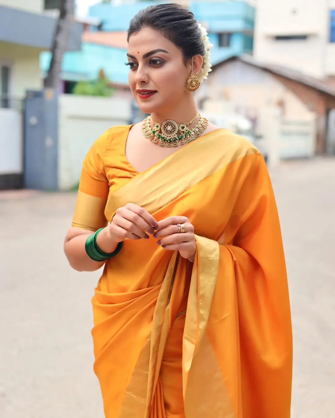 Anusree Nair Wearing Beautiful Earrings Jewellery Orange Saree Blouse